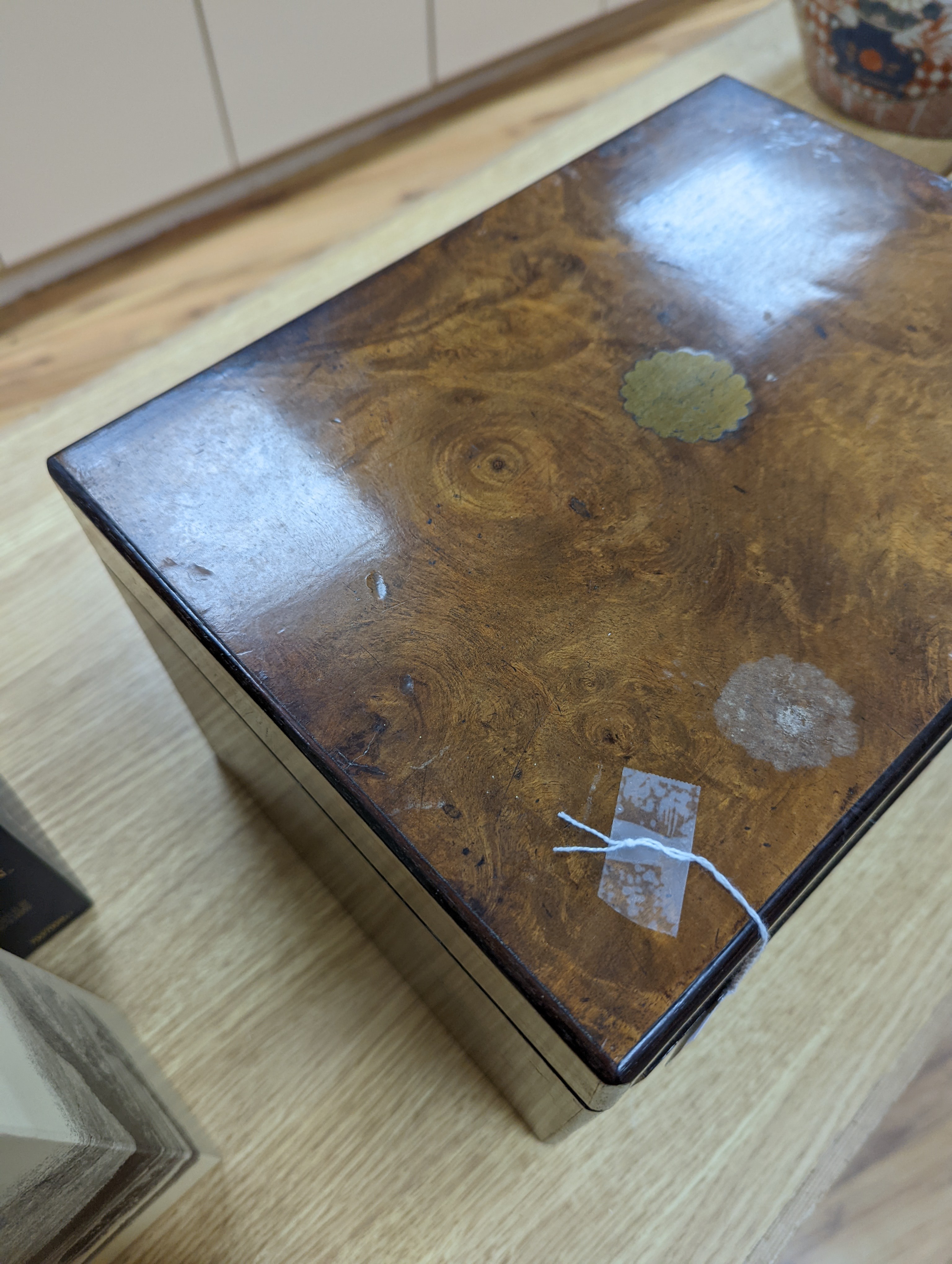 A Victorian walnut sewing casket, 34cm, containing sewing related accessories